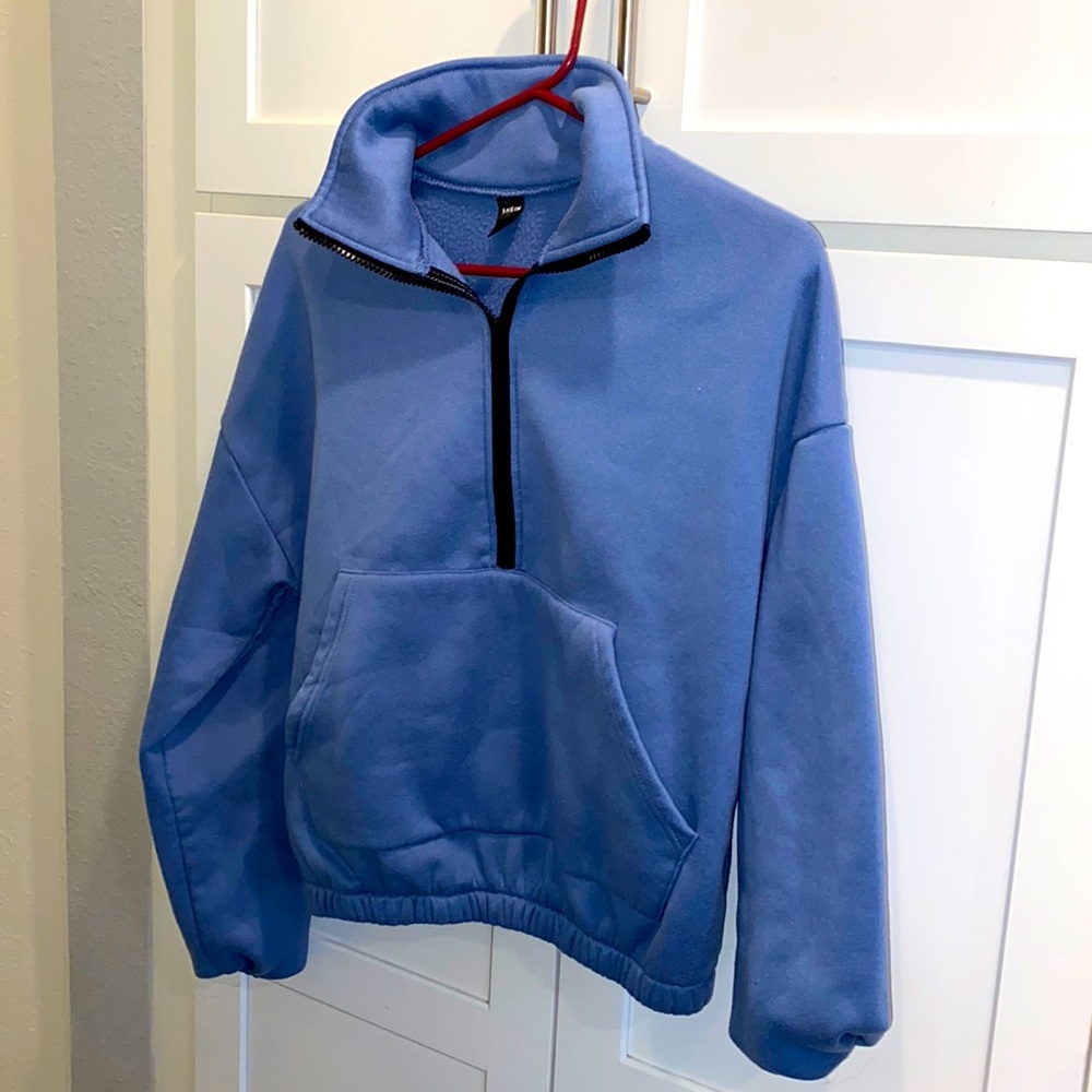 A cropped half zip up sweatshirt
